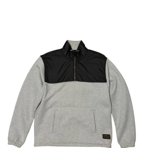 Grå och svart tröja från Levi's Skateboarding Collection - Säljer en grå och svart tröja från Levi's Skateboarding Collection. Tröjan har en dragkedja framtill och en stor ficka på magen. Perfekt för en avslappnad stil. Den är tillverkad i ett mjukt material och har en etikett med märkets logga.