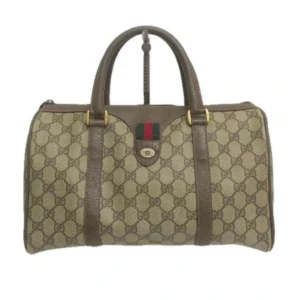 Gucci Väska - DETALJER Ursprung: Italien Material: canvas  Färg: brun Tillbehör: inga  SKICK Utsida: I gott skick, med några tecken på användning.  Insida: I gott skick, med vissa tecken på användning.