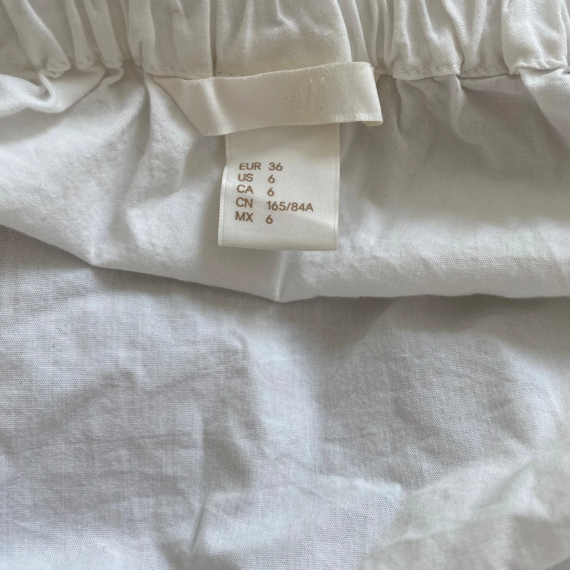 Vit oneshoulder topp - 90