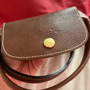 Red Longchamp purse in good condition.