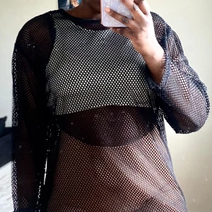 Strandklänning - Svart strandklänning med hållar