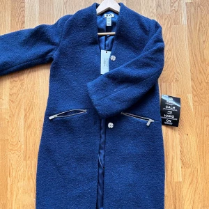 blue spring jacket  - brand new spring jacket. extremely cute for spring and autumn. very trendy 