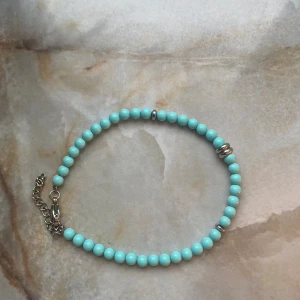 Blått pärlarmband  - Köpt utomlands, inte använd 