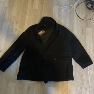 En kappa  - Den här jackan är som ny bra skick storlek xs s 