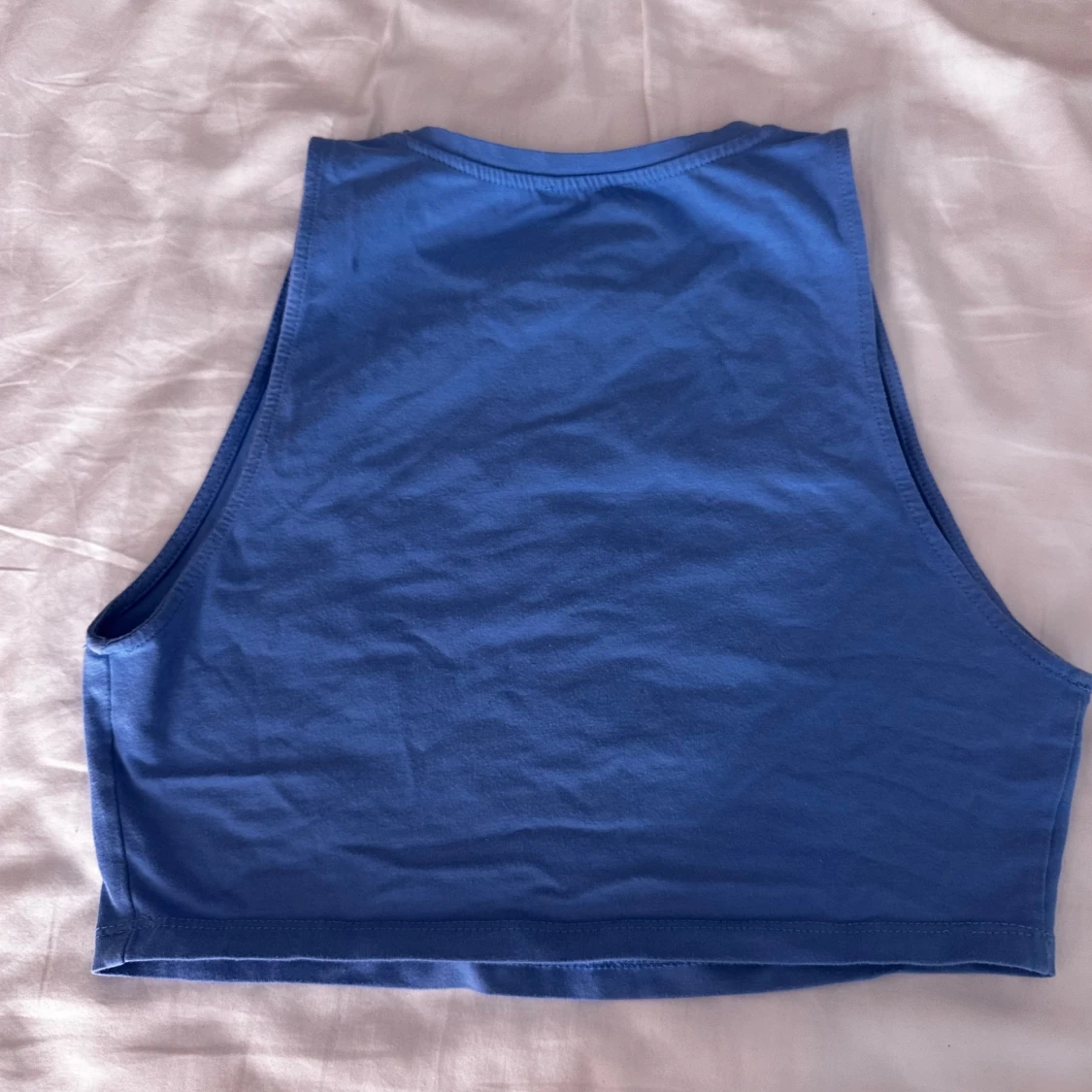 Blå ärmlös topp - 90