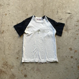 Reworked Raglan Tee - Crafted from a trio of vintage T-shirts, expertly combined in the timeless raglan cut, each shirt thoughtfully selected to form this unique piece.