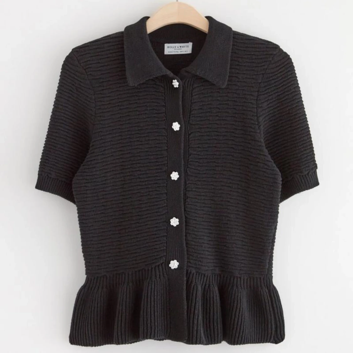 Stickad kortärmad kofta