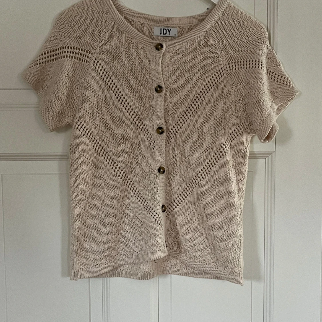 Stickad kortärmad tröja 