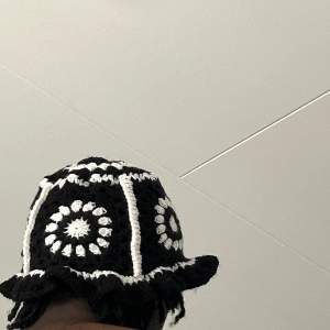 Black Granny square bucket hat with white detailing 