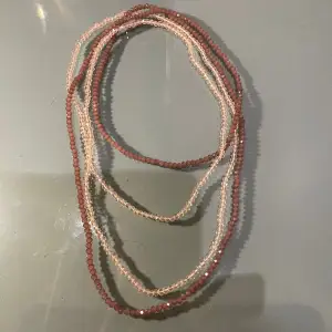 Halsband i mörk och ljus rosa