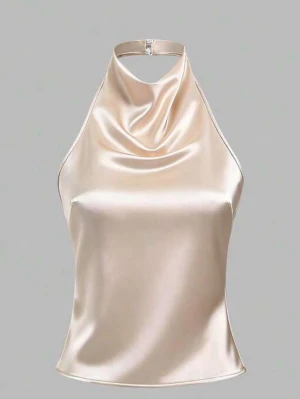 Champagnefärgad satin topp - Snygg champagnefärgad linnetopp. Toppen har smala band som knyts i ryggen. Aldrig använd pga för liten för mej💕