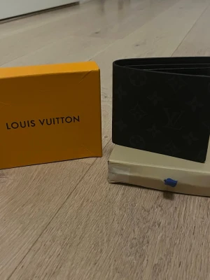 Black Wallet  - Black design Wallet. Never used. Comes in the packaging in the photos. You know why the price is like that😉