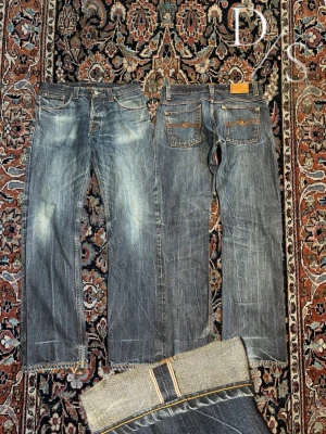 Nudie average Joe Selvedge jeans - Riktigt schyssta nudie Selvedge jeans, dessa har en riktigt schysst tvätt som tar lång tid att åstadkomma. Passformen är en trendig  Bred  passform. Midja:41,5cm Längd:105cm Benöppning:20cm(jeansen är storlek 32/32 på insidan men måtten tyder på 31 midja)