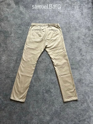 Dockers Alpha Slim Chinos - Sköna Dockers Alpha Slim Chinos med bra passform och hög kvalité. Storlek W34/L34.