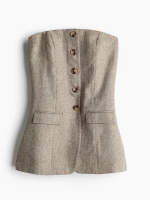 Gråbrun bandeautopp med knappar - Helt oanvänd bandeautopp. Silikonkant högst upp på insidan för att hålla den på plats. Slutsåld på H&M.