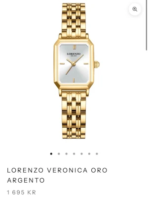 Guldfärgad klocka Lorenzo Milano - Helt ny, Stilren guldfärgad klocka från Lorenzo Milano med fyrkantig urtavla i silver och länkarmband i metall. Urtavlan har minimalistiska markeringar och klockan har en elegant, modern design som passar till många olika stilar.