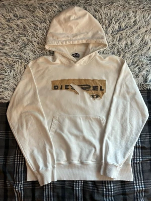 Y2K Diesel Distressed Vintage Hoodie - White Vintage Diesel Y2K hoodie Streetwear  featuring a unique graphic print on the front. Made from 100% cotton, it offers comfort and style.  ⭐️ Condition: 10/10 🎨 Color: White 🪙 Rerail: 471$ 📦 Fast and careful shipping