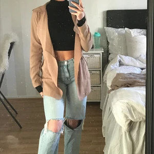 Beige kappa - En super fräsch beige kappa, perfekt till våren.