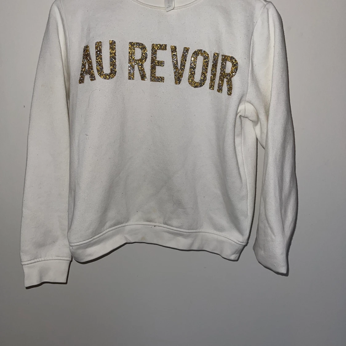 Sweatshirt med glittrig text