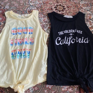 En gul och svart linne - Oanvänd 10-12år helst hämtas Knut längs ner vid mitte på båda 