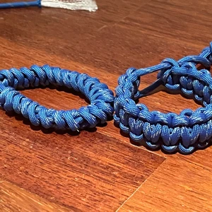Paracord bracelet ( blue) - Thoes are  made of USA and they are special because they can reflect light .