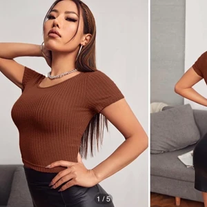 Tröja  - En super fin ribbstickad tröja. Ganska kort skulle jag säga.