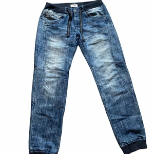 FSBN Cuffed Jeans M - Baggy jeans med snörning i midjan