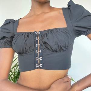 A classic balconette top that clasps at the front. Very cute and goest with many outfits