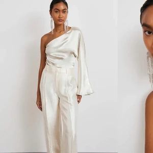 One shoulder topp Gina Tricot  - Helt ny (prislapp kvar) satintopp från Gina tricot. Alltid slutsåld online (!). Storlek 36.