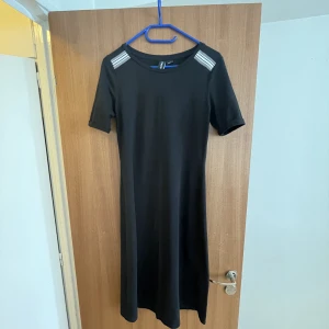 Black dress - Form fitting black dress. Knee length, short sleeve, good condition.