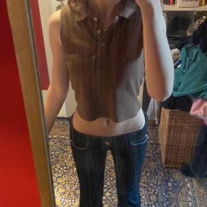 Brandy Melville sommar/vår top - En brun rop från brandy Melville som passar väldigt bra till våren/sommaren. 