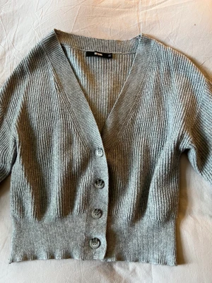 Gray Cardigan  - I have worn it limited times and it is in good shape