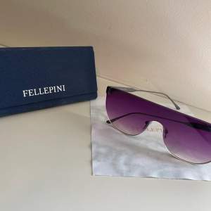Detta är ett par jättefina och nya Fellepini solglasögon som strålar i lila toner. Modellen är Fellepini S28 C16. Villig att pruta.