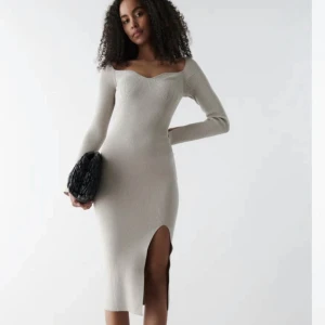 Stickad klänning  - Strl M 