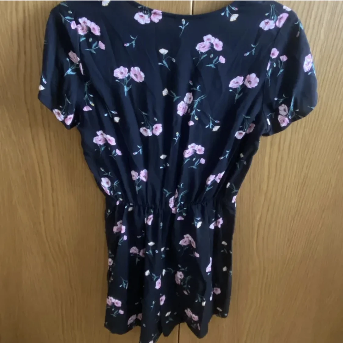 Blommig byxdress - 90