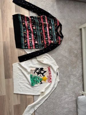 Mönstrad jultröja från Esmara, L - Säljer en stickad jultröja från Esmara i storlek L. Tröjan har ett färgglatt julmönster i svart, rött, grönt och vitt med snögubbar, granar och renar. Långärmad modell med ribbade muddar. Perfekt för vinterns alla julfiranden!