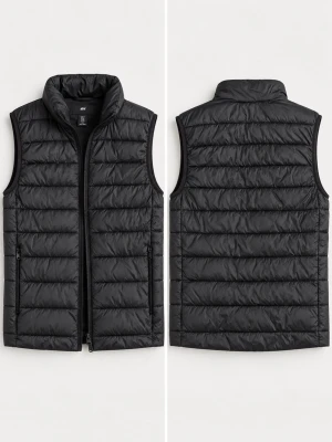 Väst från HM - Stilren svart dunväst med quiltad design och hög krage. Västen har dragkedja framtill och två sidofickor med dragkedja. Perfekt att slänga över en hoodie eller tröja för extra värme. Materialet är lätt och smidigt, vilket gör den enkel att bära och matcha.