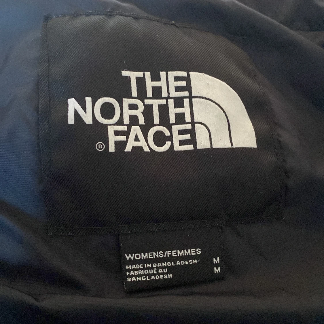 En blå North face jacka  - 90