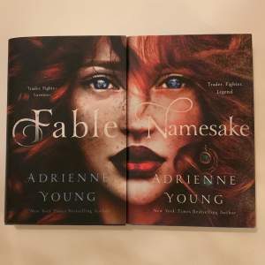 Båda böckerna, Fable & Namesake, i Fable serien av Adrienne Young. Båda böckerna är inbundna och i mycket bra skick!