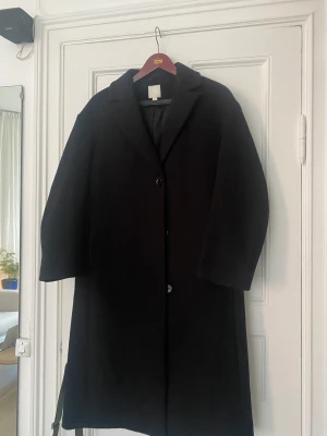 H&M kappa  - Använd en gång. Oversize modell.