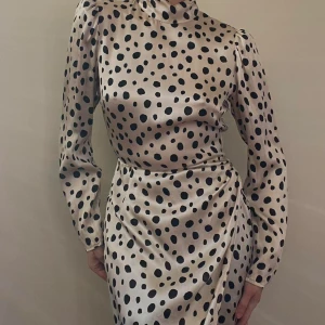 Reformation Silk Printed Dress - Preloved Reformation Silk Dress  Watercolor Dotted Black Print on Beige Silk  100% Silk  Open Back Slit, Side Front Slit  Excellent Condition