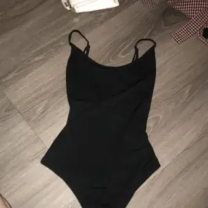 Monki black bodysuit that I used to wear a lot. It’s in great condition, has adjustable straps and is very comfortable. 