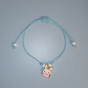 Armband - blått band med kanin motiv