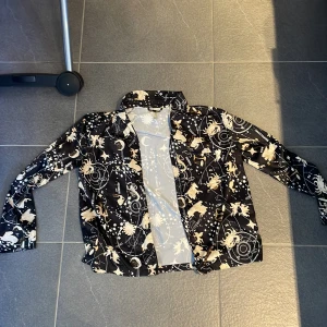 Star sign top - Super cool top can be used as either a cardigan or even a pyjama top due to the soft material. Several star signs are on it along with their constalations