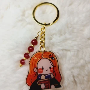 Nyckelring Harry Potter Ginny - Söt nyckelring med Harry Potter tema. 