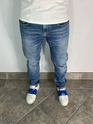Replay Anbass Jeans - CONDITION — 9/10 Excellent condition.  Light signs of wear.     SIZE — 31/32 Model is 170 cm, 67kg  MEASUREMENTS (CM) (Please refer to the last photo for measurement guide)  A — 42 cm  B — 104 cm  C — 16 cm