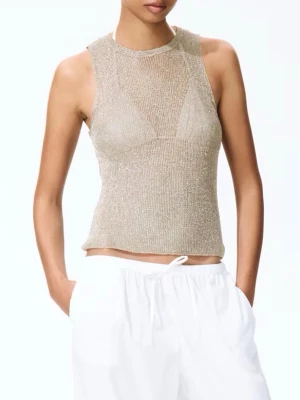 Metallic stickat linne - H&M - NY - En figurnära, ärmlös topp i stickad viskosblandning med metallicskimmrande tråd. Toppen har rund halsringning och rak skuren nedkant. Ord pris: 149kr