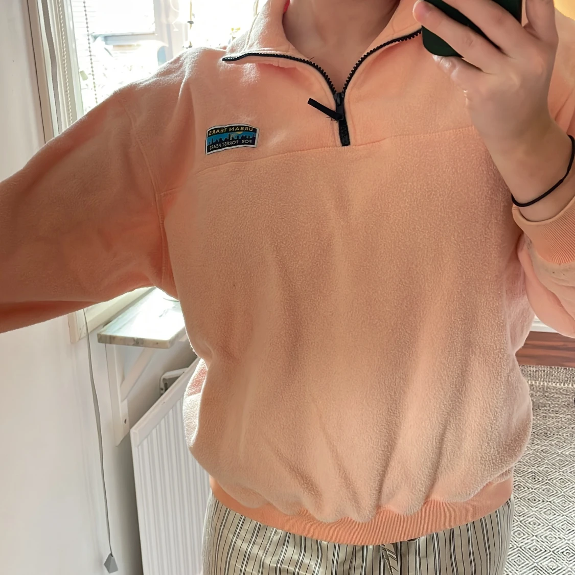 Orange/persikafärgad fleecetröja  - 90