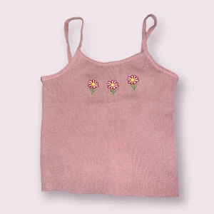 Blommig linne - Rosa blommig linne i storlek small.streatch bar.