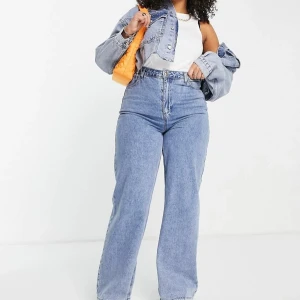 Oanvända ljusblåa jeans med vida ben och hög midja - Ljusa jeans med vida ben och hög midja från ASOS - oanvända 